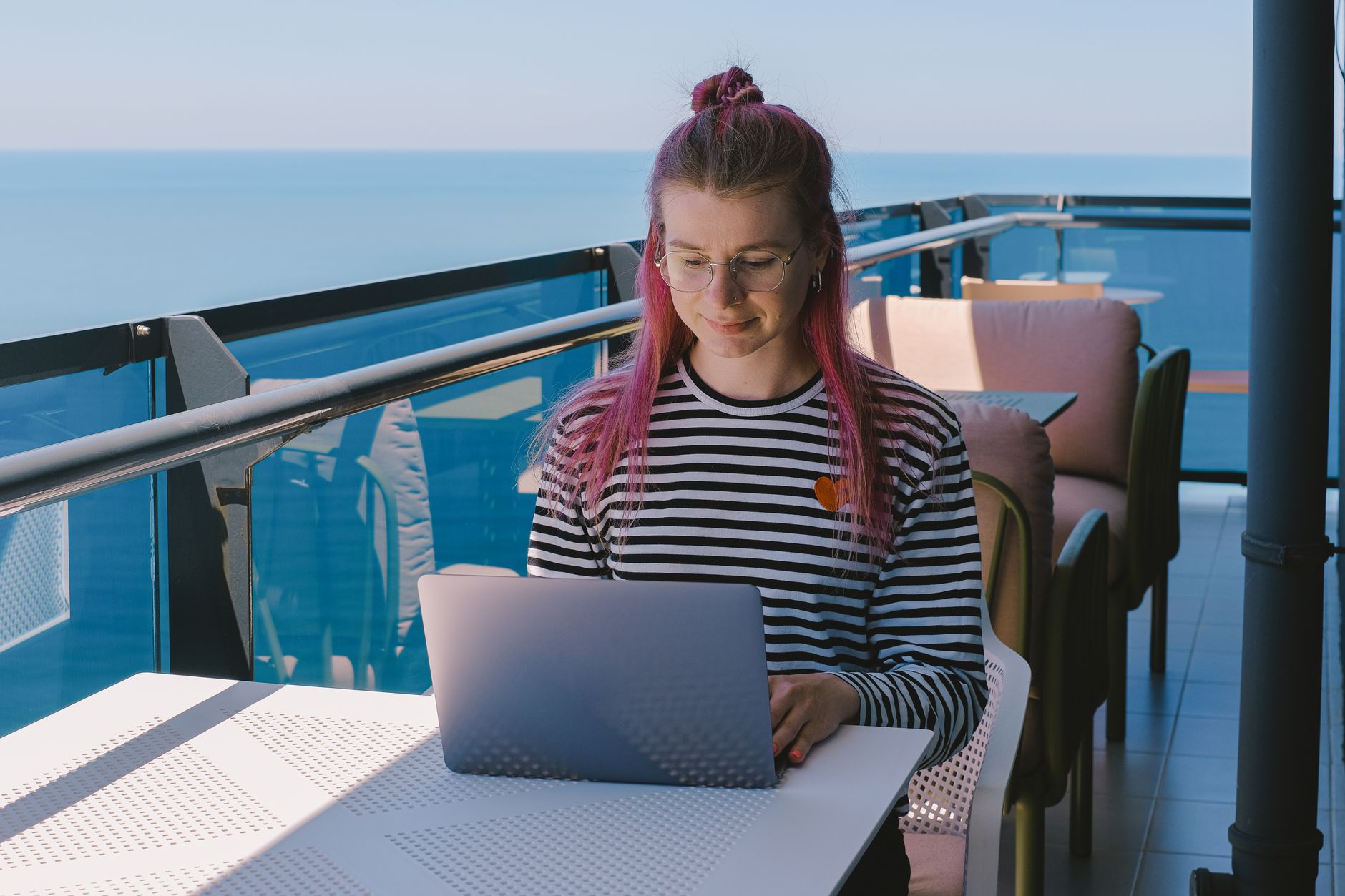 A modern coworking space in Ponta Delgada with stone walls and high-speed workstations.